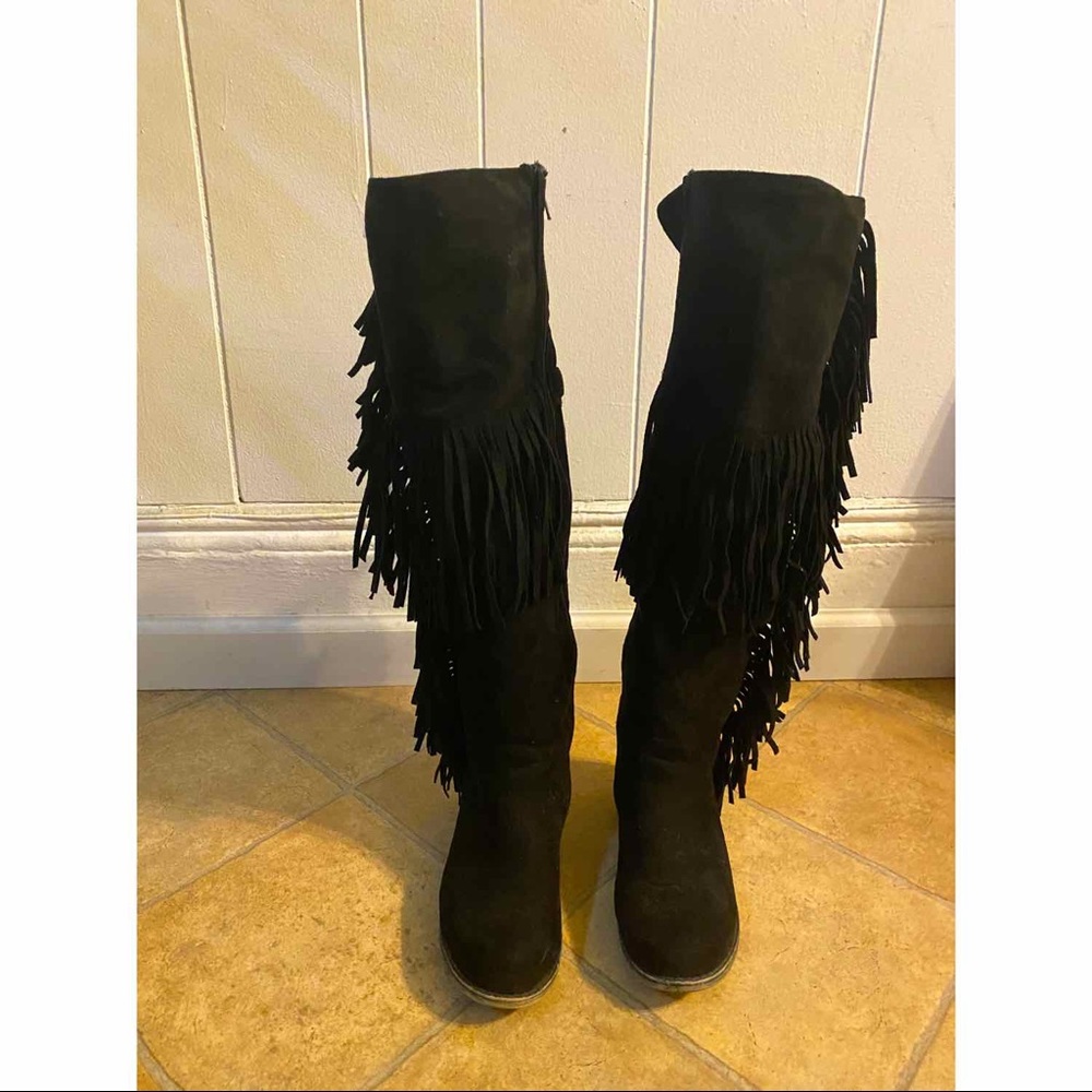 Knee high fringe boots